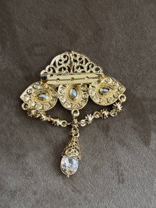 Broche doré