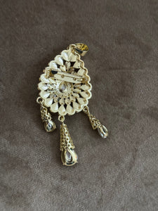Broche doré
