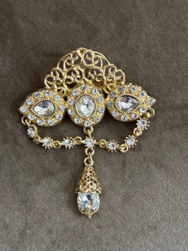 Broche doré